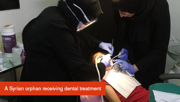 Orphan receiving dental treatment