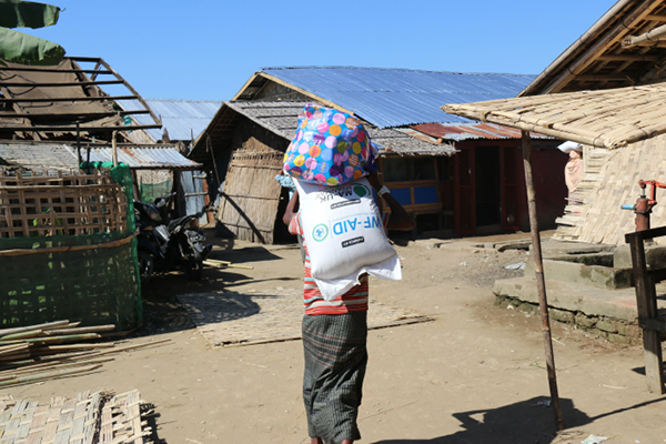 Man carrying aid